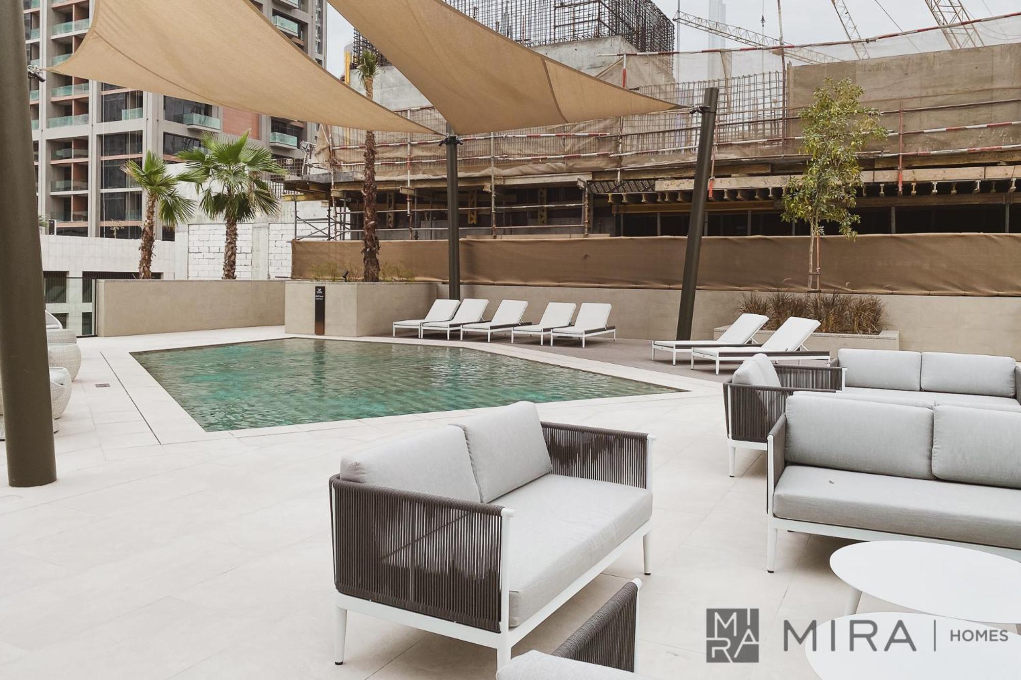 Stylish 1br In Peninsula Five Views & Pool Apartment Dubai